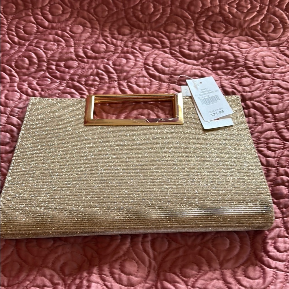 I purchased Gold Clutch with Metal Handle. very Small scratches on handle.